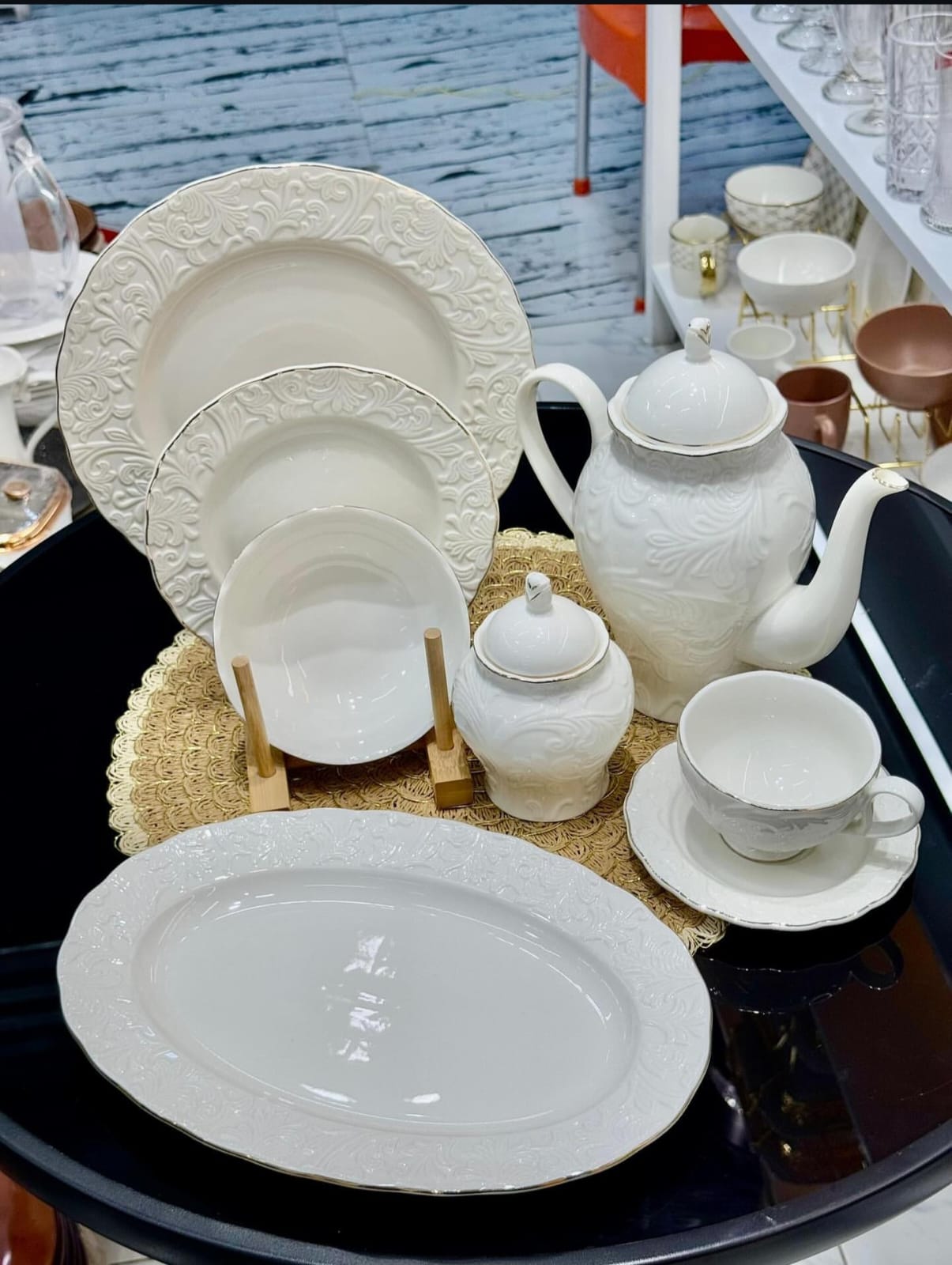 39pcs white porcelain embossed dinner set full display with teapot, platters, plates, bowls and cups