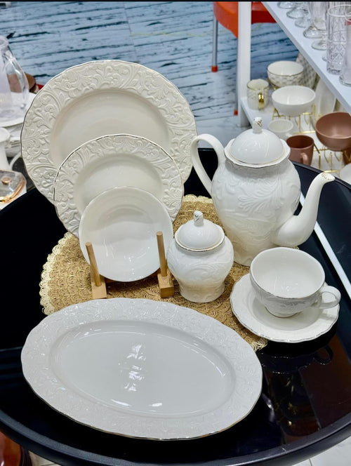 39pcs white porcelain embossed dinner set full display with teapot, platters, plates, bowls and cups