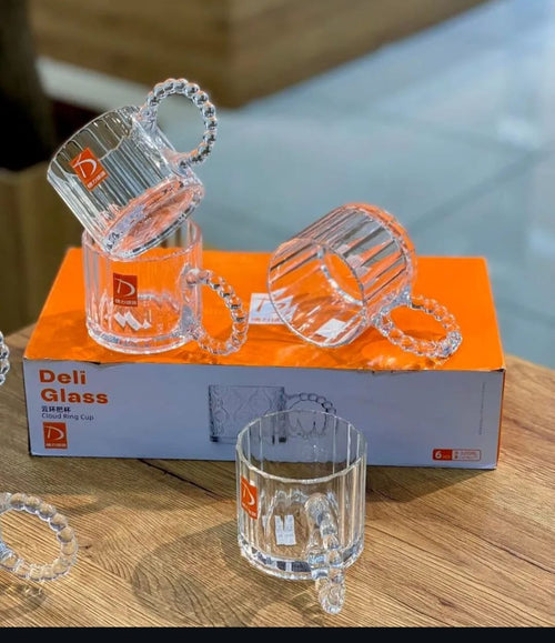 Deli Glass Cloud Ring Cup set of 6 displayed on marble tray with floral background