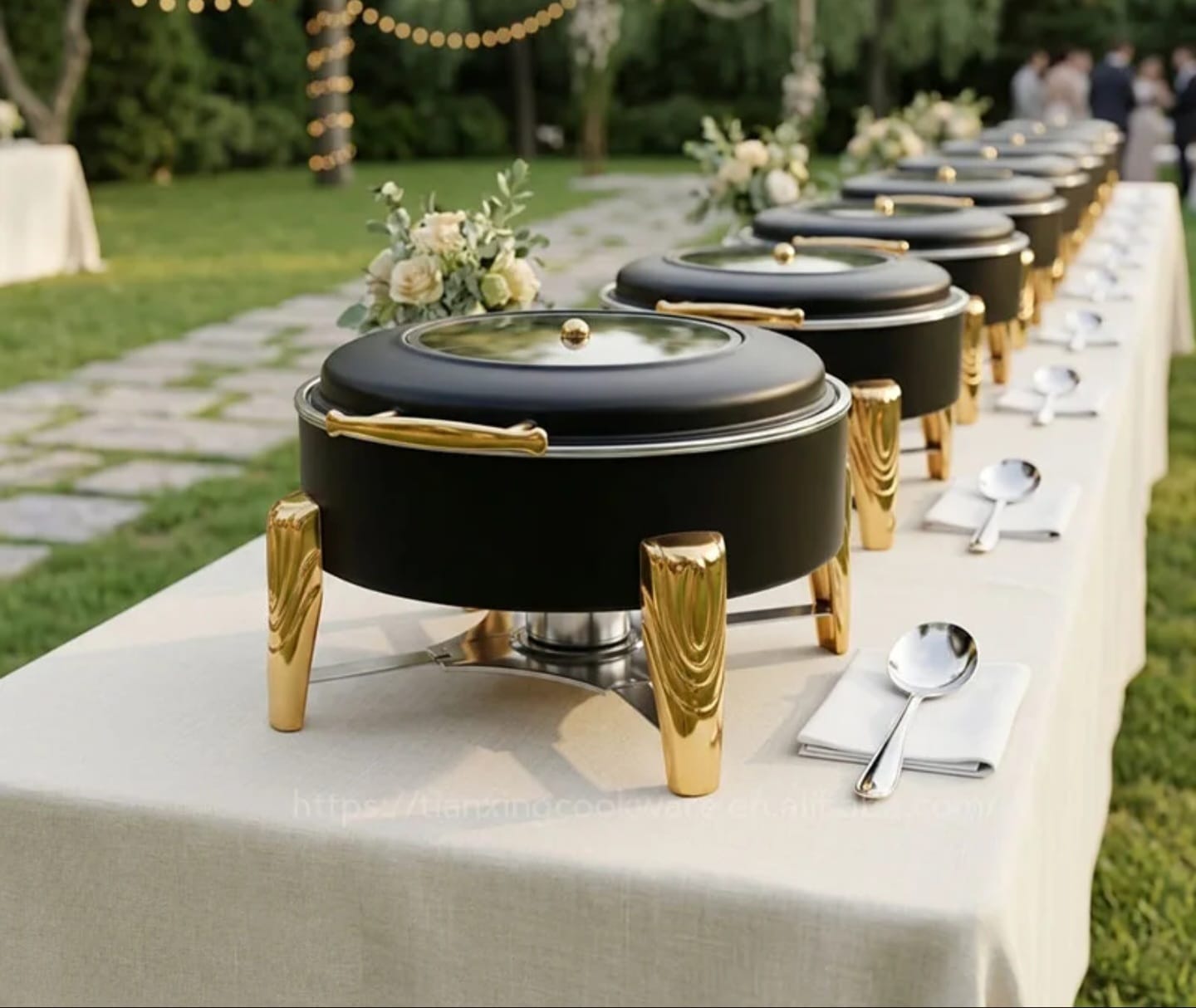 Black and Gold Square Hydraulic Chafing Dishes lined up at outdoor wedding buffet