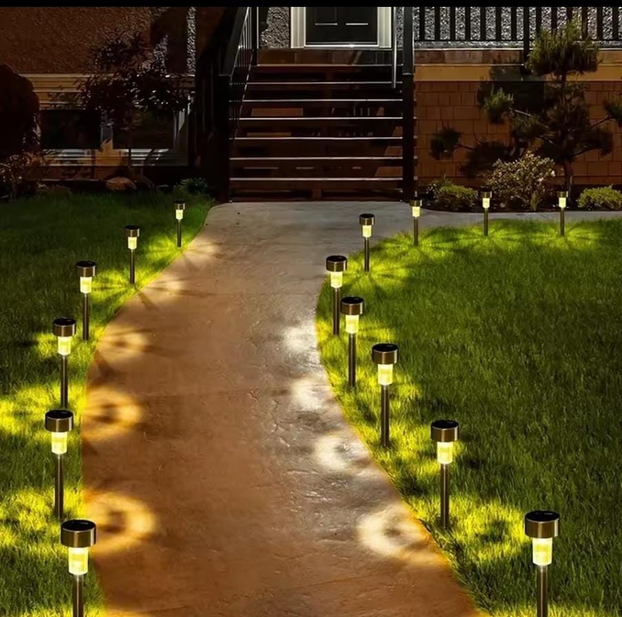Solar pathway lights lining a garden walkway at night