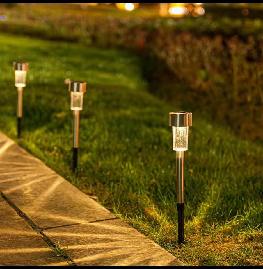 Close-up of stainless steel solar pathway light stake