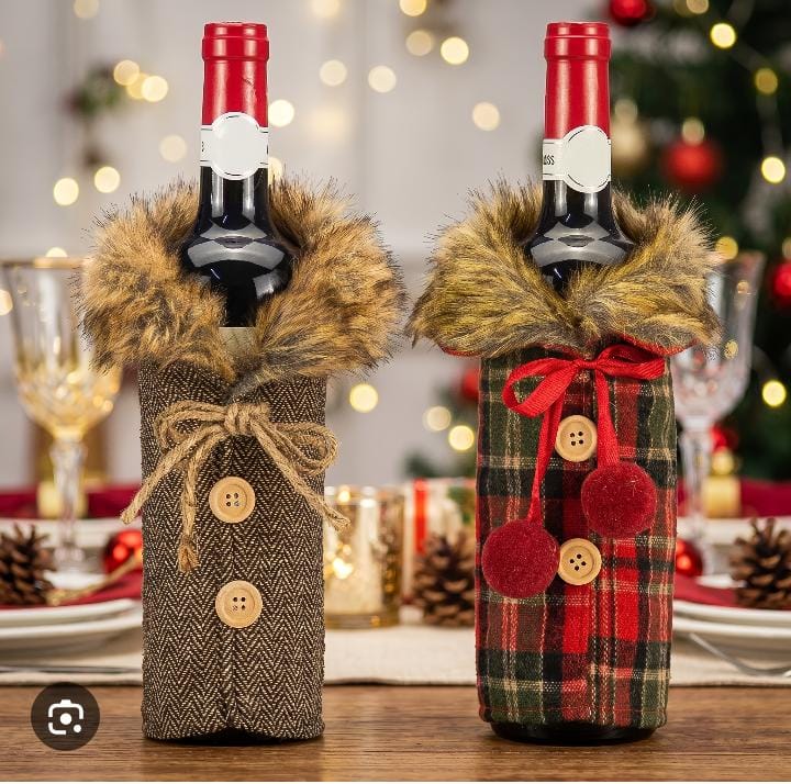 Wine bottles dressed in brown patterned and red checked gift wraps with fluffy-look collars, buttons and bows