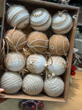 Box of 12 ivory and champagne-gold Christmas baubles with pearl-style trim, ornate patterns and rustic cord textures