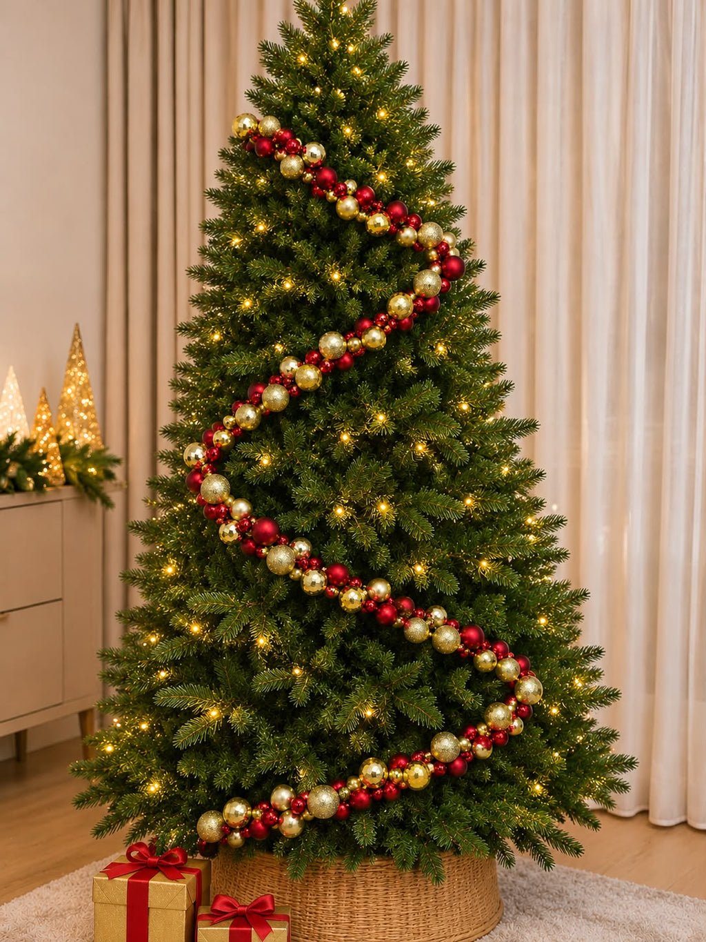 Red and gold Christmas ball garland with 6cm baubles draped around a lit Christmas tree